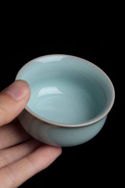 Artistic side-lit photo highlighting the subtle blue tones and glossy texture of the Azure Sky glaze.