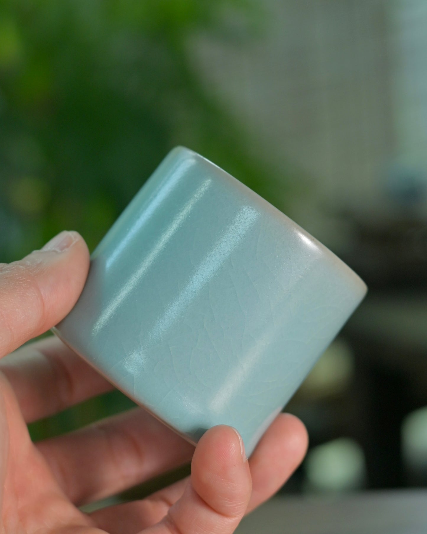 Agate-enhanced glaze creating luminous depth and subtle jade-like transparency in Ru ware