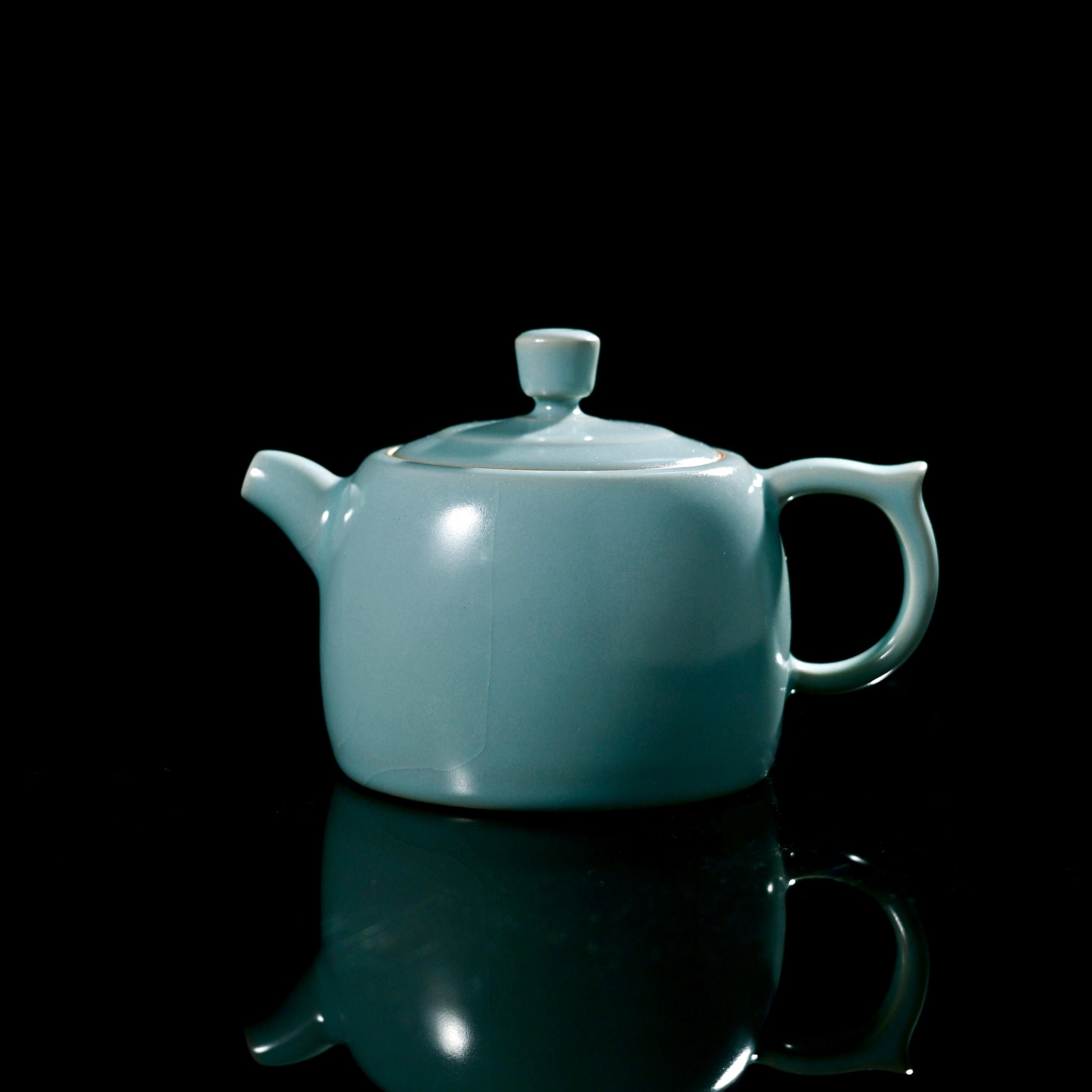 Ru ware celadon Jinglan teapot showcasing classic well curb shape and sky-blue glaze