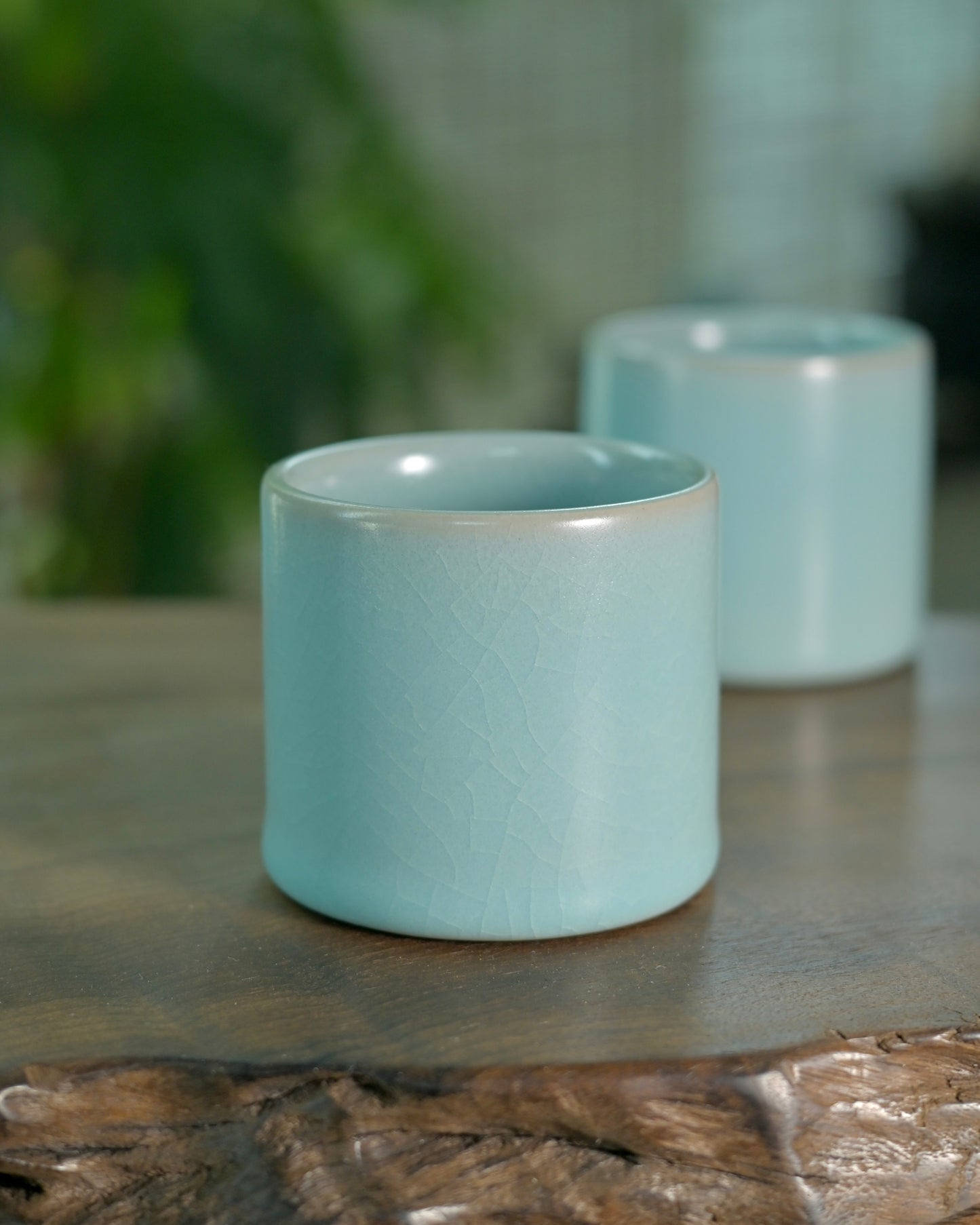 Ru ware ergonomic thumb cup designed for comfortable finger-held tea drinking rituals