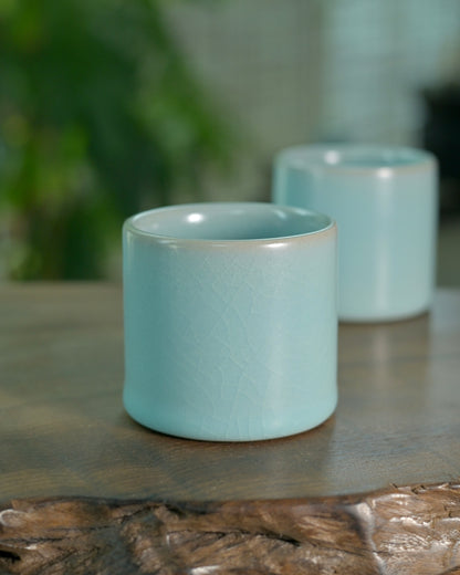 Ru ware ergonomic thumb cup designed for comfortable finger-held tea drinking rituals