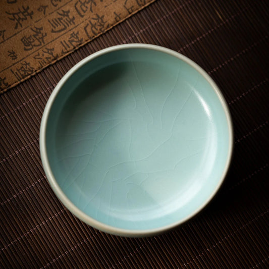 Traditional Ru ware porcelain teacup with celadon glaze and subtle crackle finish
