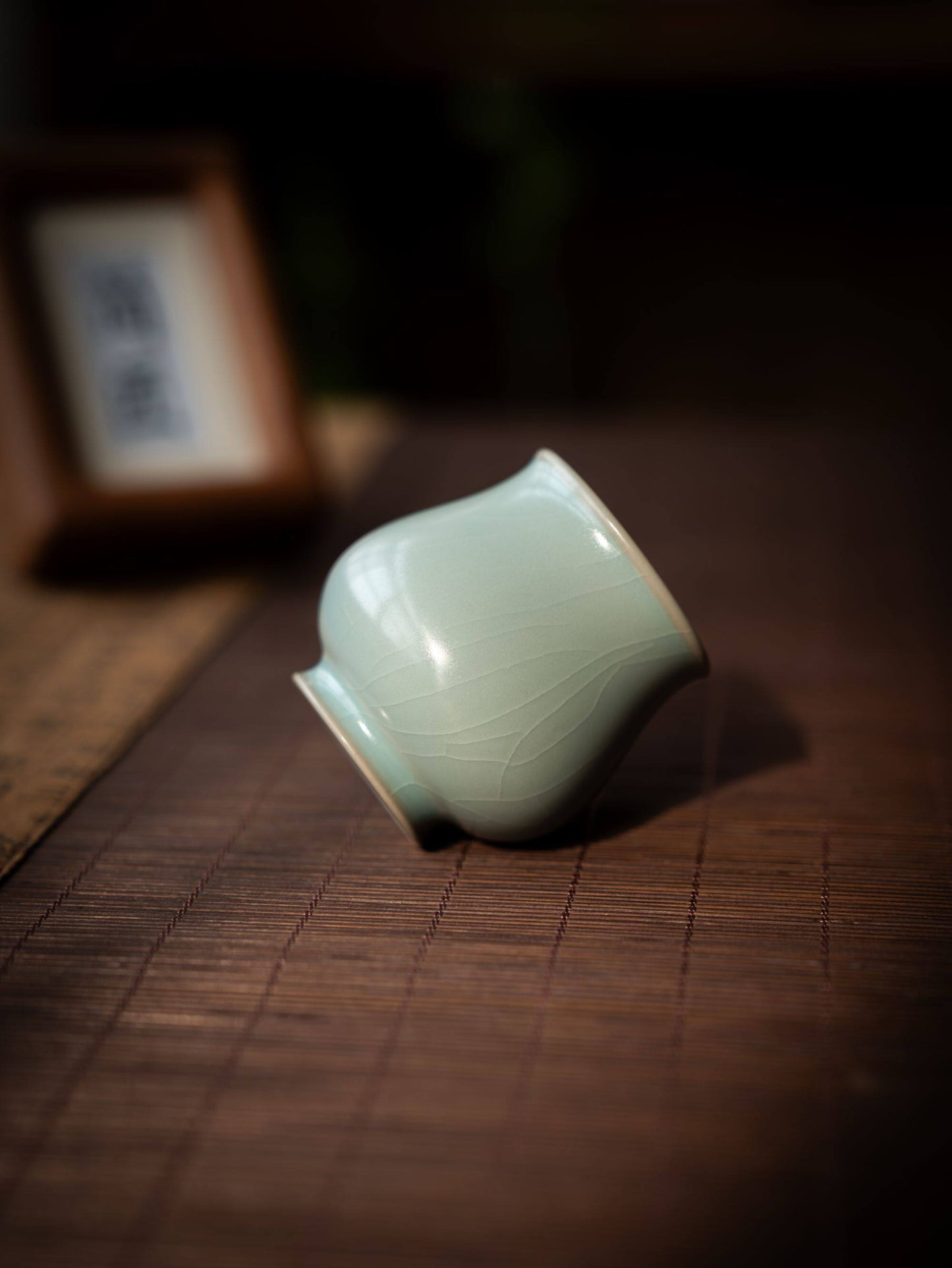 Song Dynasty style celestial blue glazed porcelain cup held in a person's hand.