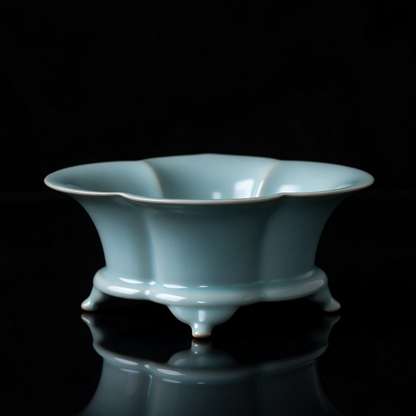 Handcrafted Ru Ware sky blue foliated basin used as fruit bowl and tea wastewater vessel on wooden table