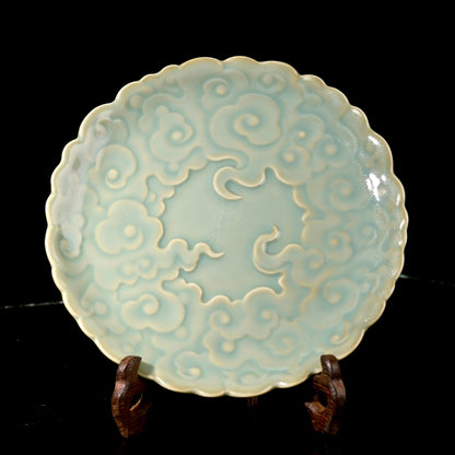 Ru Ware sky-blue glazed auspicious cloud embossed teapot tray resting on rustic dark wood table