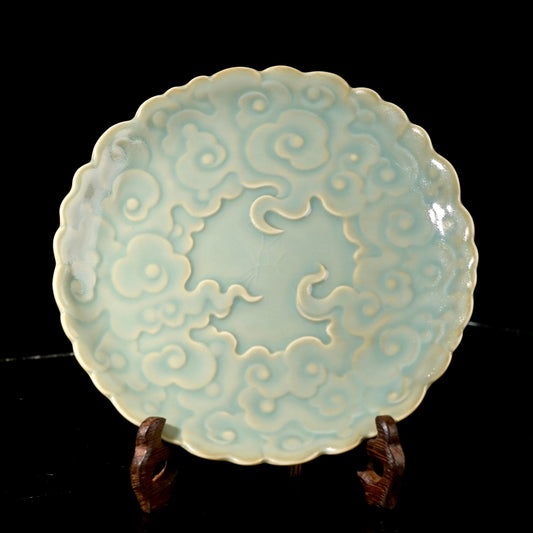 Ru Ware sky-blue glazed auspicious cloud embossed teapot tray resting on rustic dark wood table