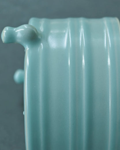 Rare crackle-free Ru ware tripod Zun with soft blue glaze and exposed incense ash clay details