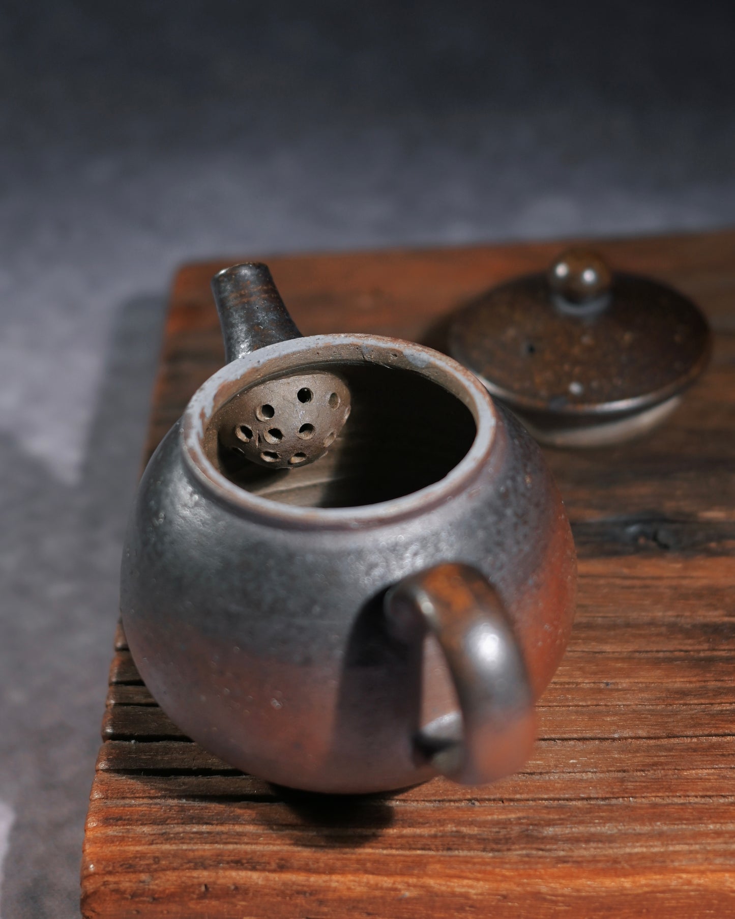 Rustic Chinese Zen teapot adding quiet meditative aesthetic to tea ceremony sessions