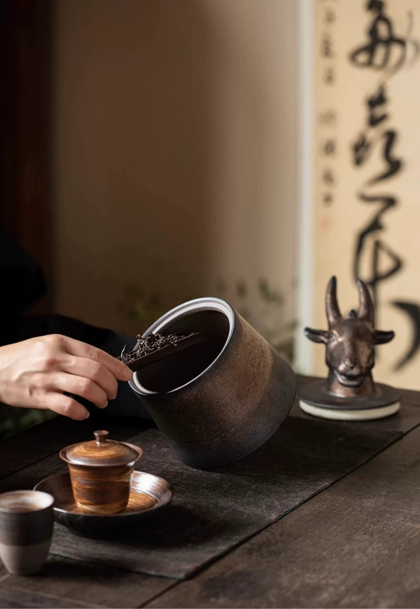 Rustic pottery tea canister with sculpted animal head