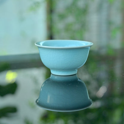 11th century inspired Ru porcelain cup with pure monochrome glaze, showing historical traces through tea use