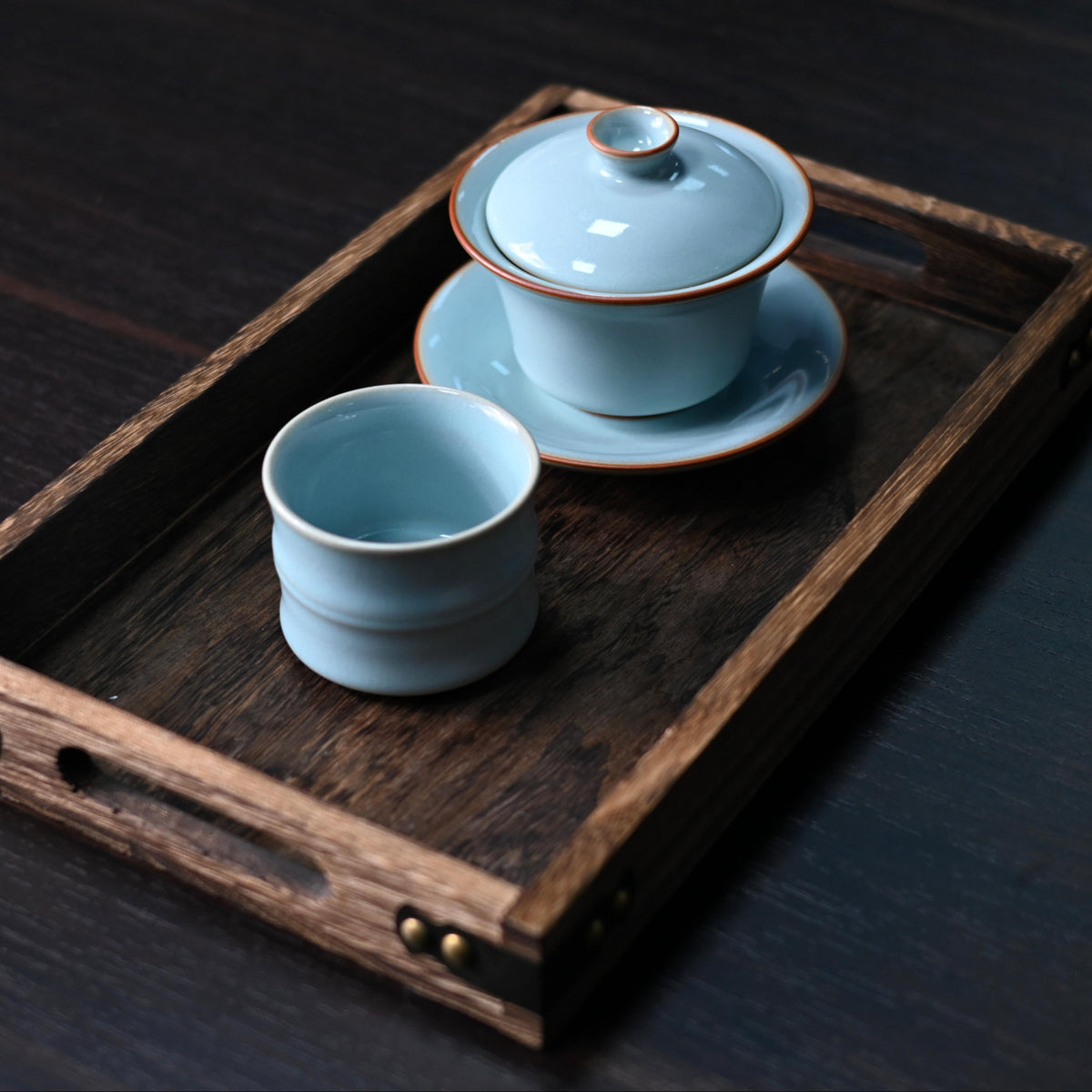 Handmade Ru ware gaiwan crafted in Ruzhou, subtle natural crackle on sky-cyan celadon, traditional Chinese tea ceremony vessel