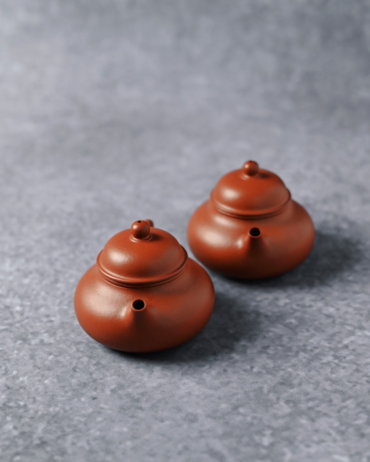 Unglazed Zhuni clay surface with fine texture and warm vermilion tone from original Yixing ore