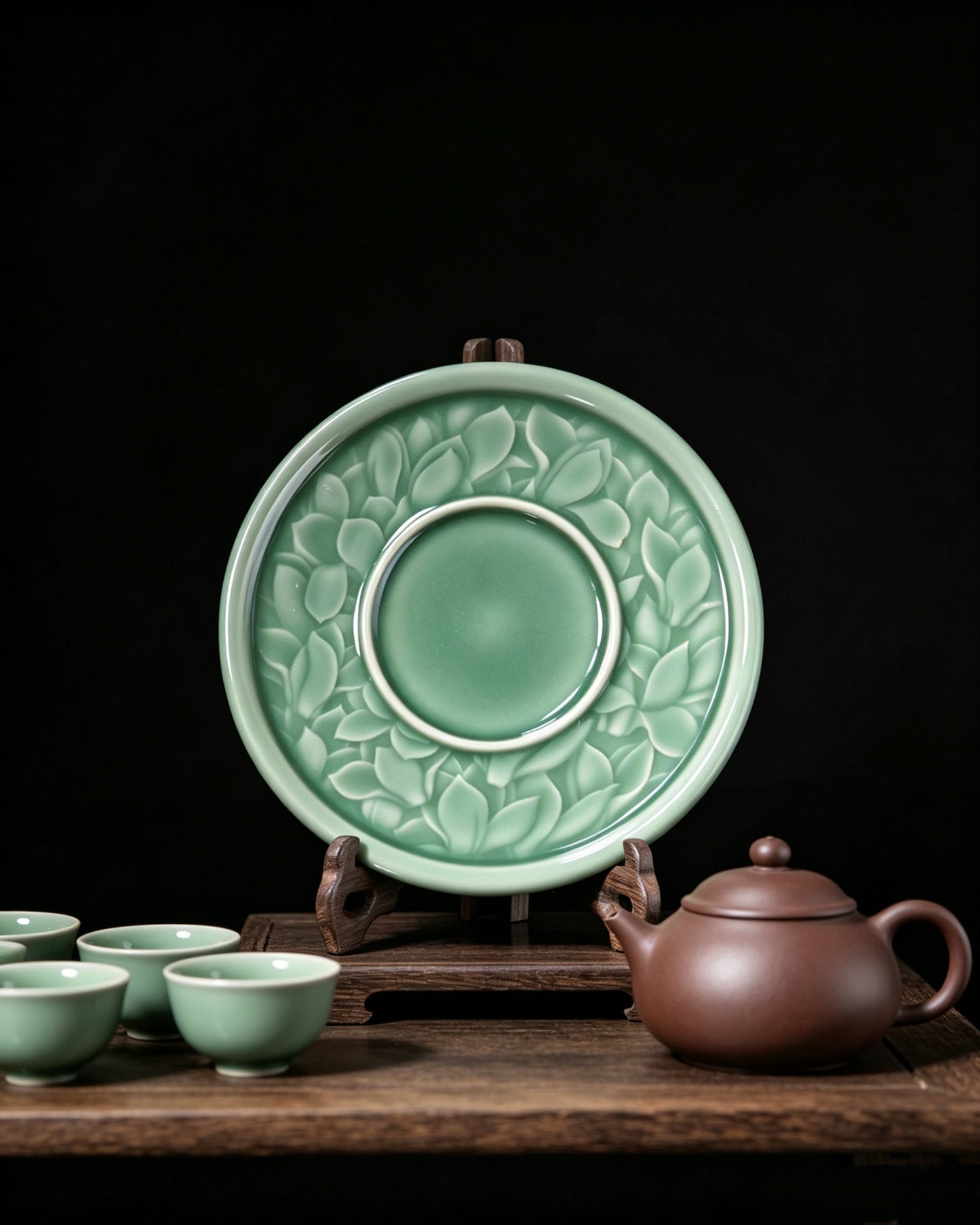 Deep plum jade glaze Longquan celadon teapot rest, detailed magnolia flower texture tea mat display