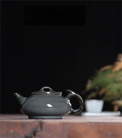 Longquan celadon tea set featuring traditional glaze and crackle patterns