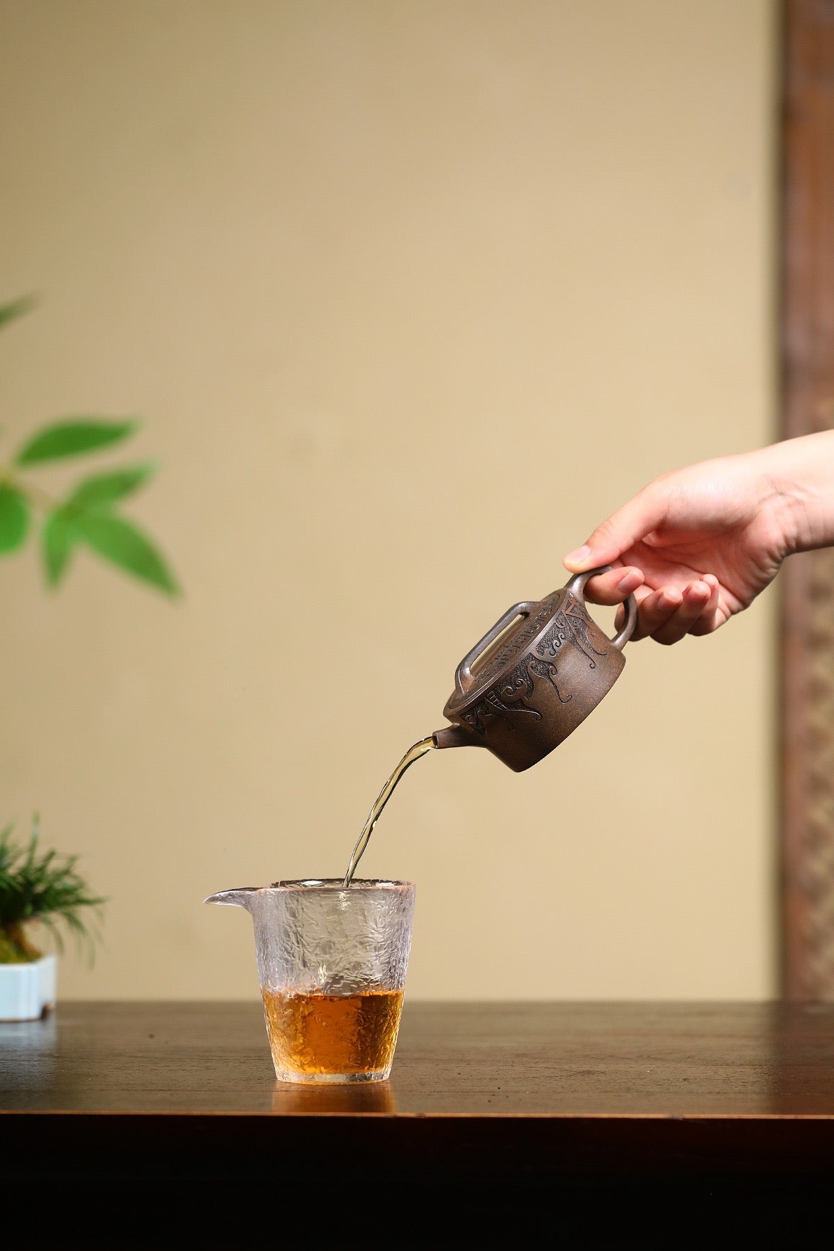 Completely handmade Yixing teapot from clay preparation to carving, showcasing authentic traditional craftsmanship