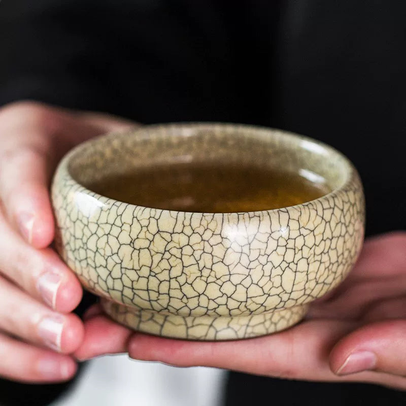 Handcrafted Ge Kiln style tea cup with iconic gold thread and iron wire crackle glaze