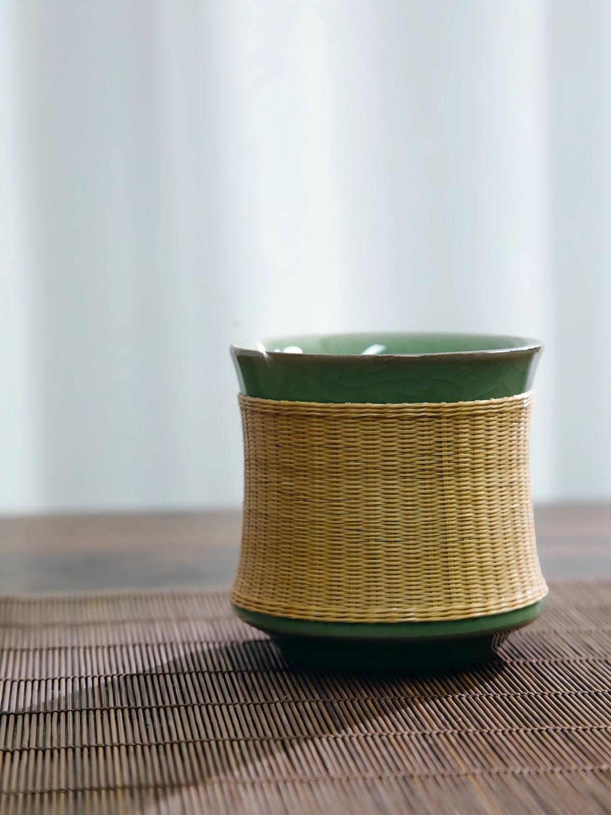 Yuanrong harmony‑style celadon teacup with hand‑woven bamboo wrap, classic Ge‑Yao plum‑green glaze tea ware