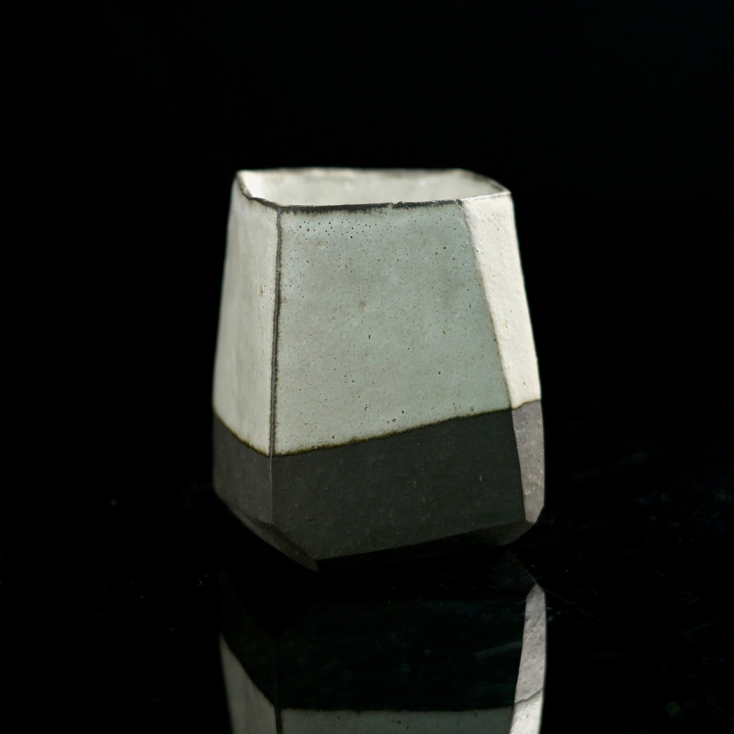 Kohiki-style tea cup with complete white slip coating covering both interior and exterior surfaces