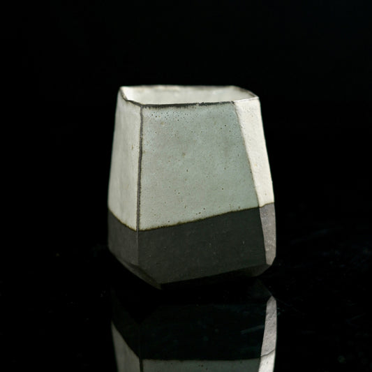 Kohiki-style tea cup with complete white slip coating covering both interior and exterior surfaces