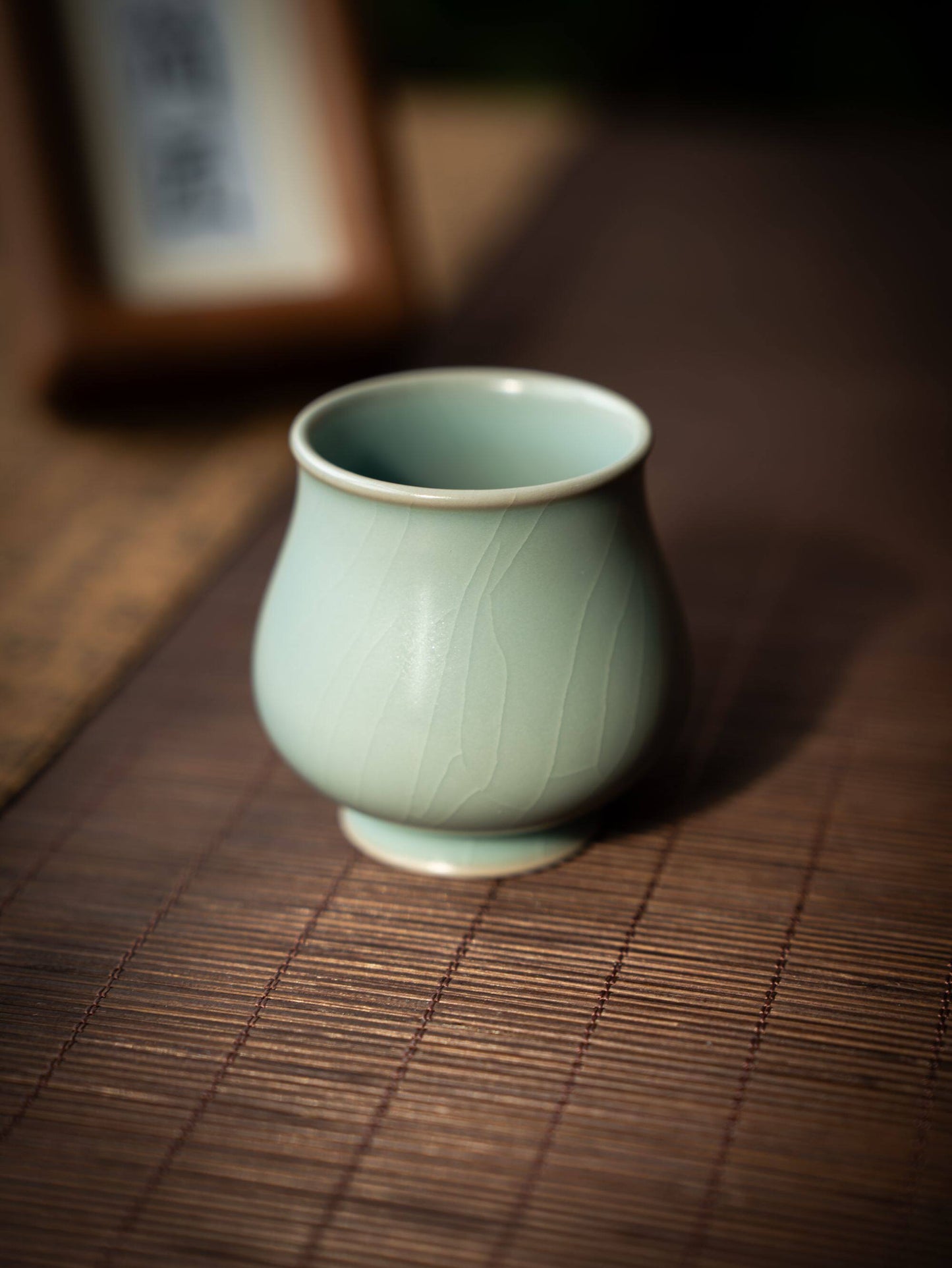 Close-up of the delicate cicada-wing crackle glaze on a premium Chinese teacup.