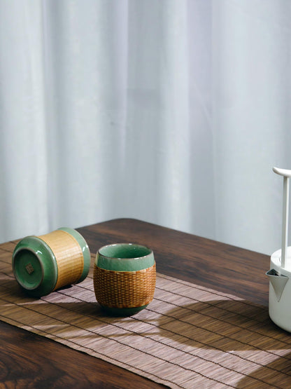 Saanwu Studio bamboo‑joint Longquan Ge‑Yao celadon teacup fitted with hand‑woven bamboo sleeve, handmade Chinese tea collectible