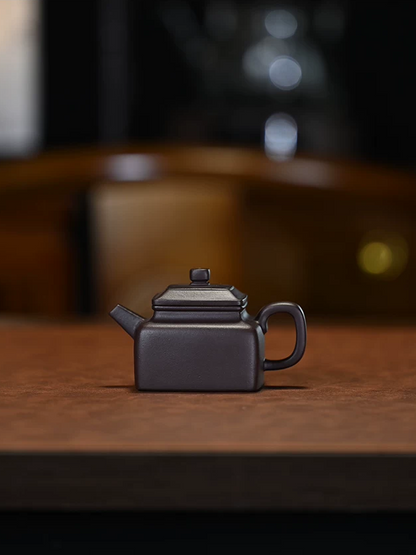 Square form Yixing teapot built by hand-piecing clay slabs then refined for precise craftsmanship