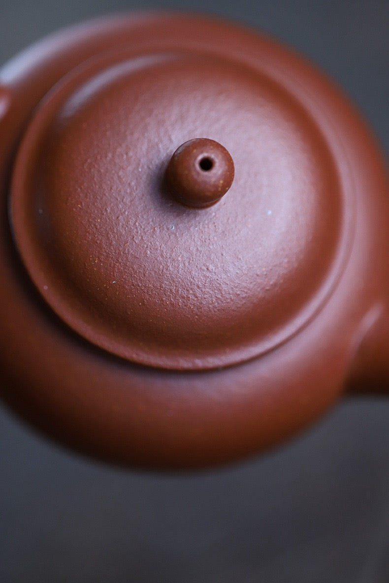 Yixing Jiangpo clay teapot semi-handmade by folk artisan, preserving traditional zisha craftsmanship methods