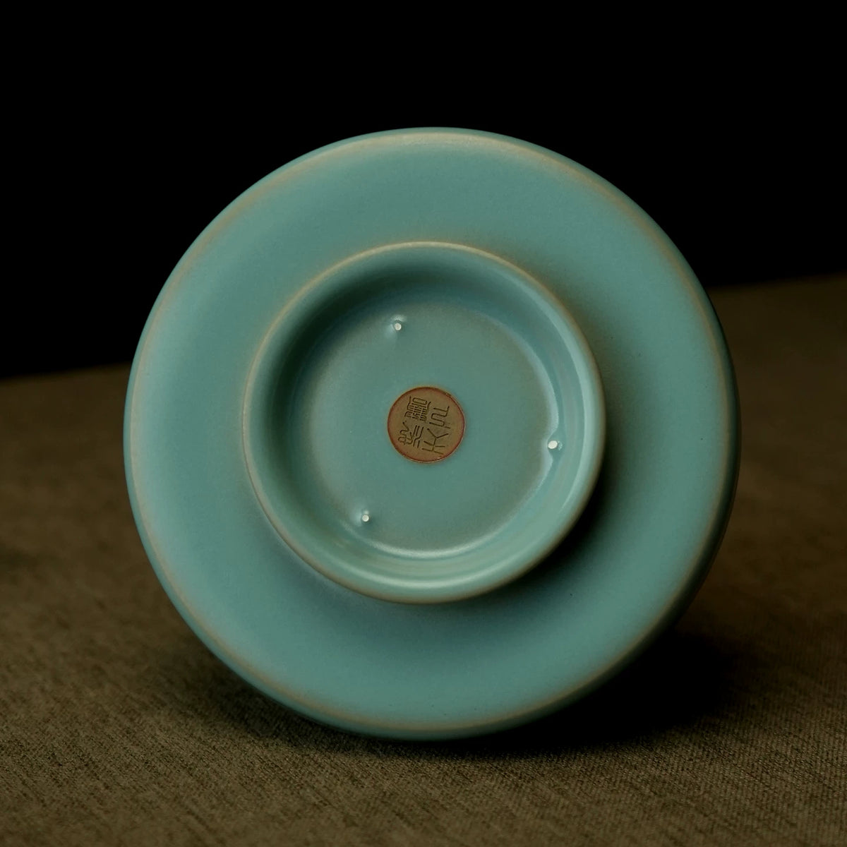 Top-down view of Ru kiln sky-blue dragon handle cup showing petal-shaped rim and deep interior   