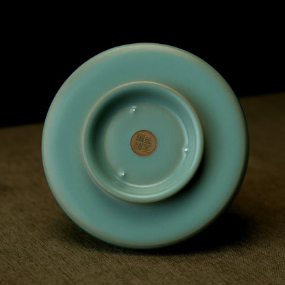 Top-down view of Ru kiln sky-blue dragon handle cup showing petal-shaped rim and deep interior   