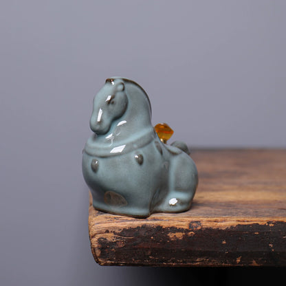 Handmade Longquan Celadon horse figurine displaying jade-like glaze texture and crackle lines