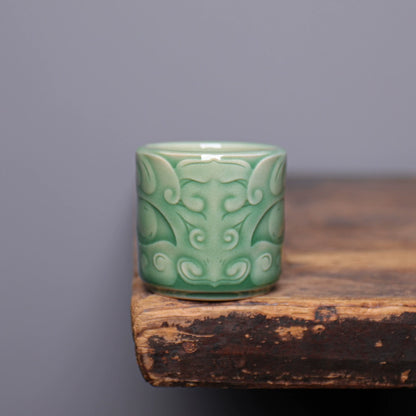 Top view of Longquan Celadon Taotie mask teacup showing smooth porcelain interior and rim
