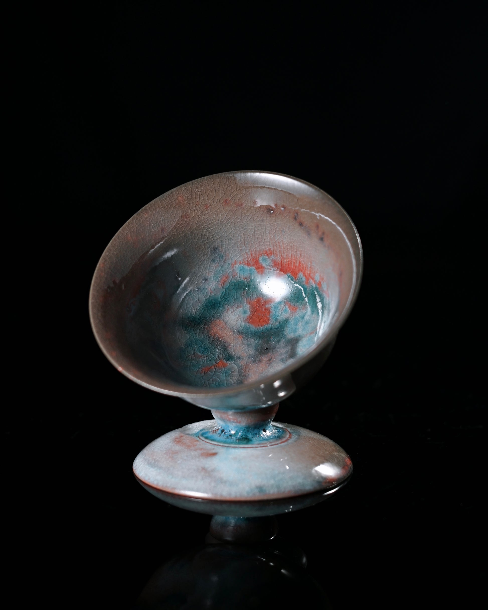 Kiln sweat adorned tea bowl with celestial glaze colors, perfect for personal tea tasting sessions
