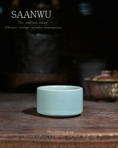Hand‑made Chinese ceramic teacup with serene sky‑blue glaze, timeless Ru‑style craft for tea enthusiasts