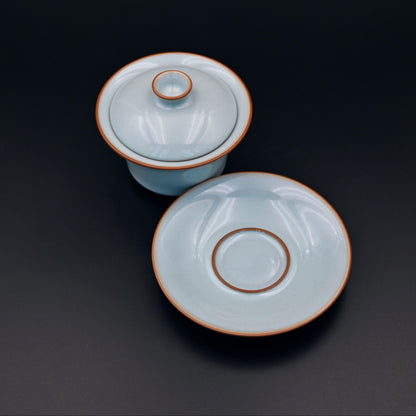 Heritage Ru porcelain gaiwan with sky-cyan agate-infused glaze, revived Northern Song Ru kiln craft for premium gongfu tea brewing