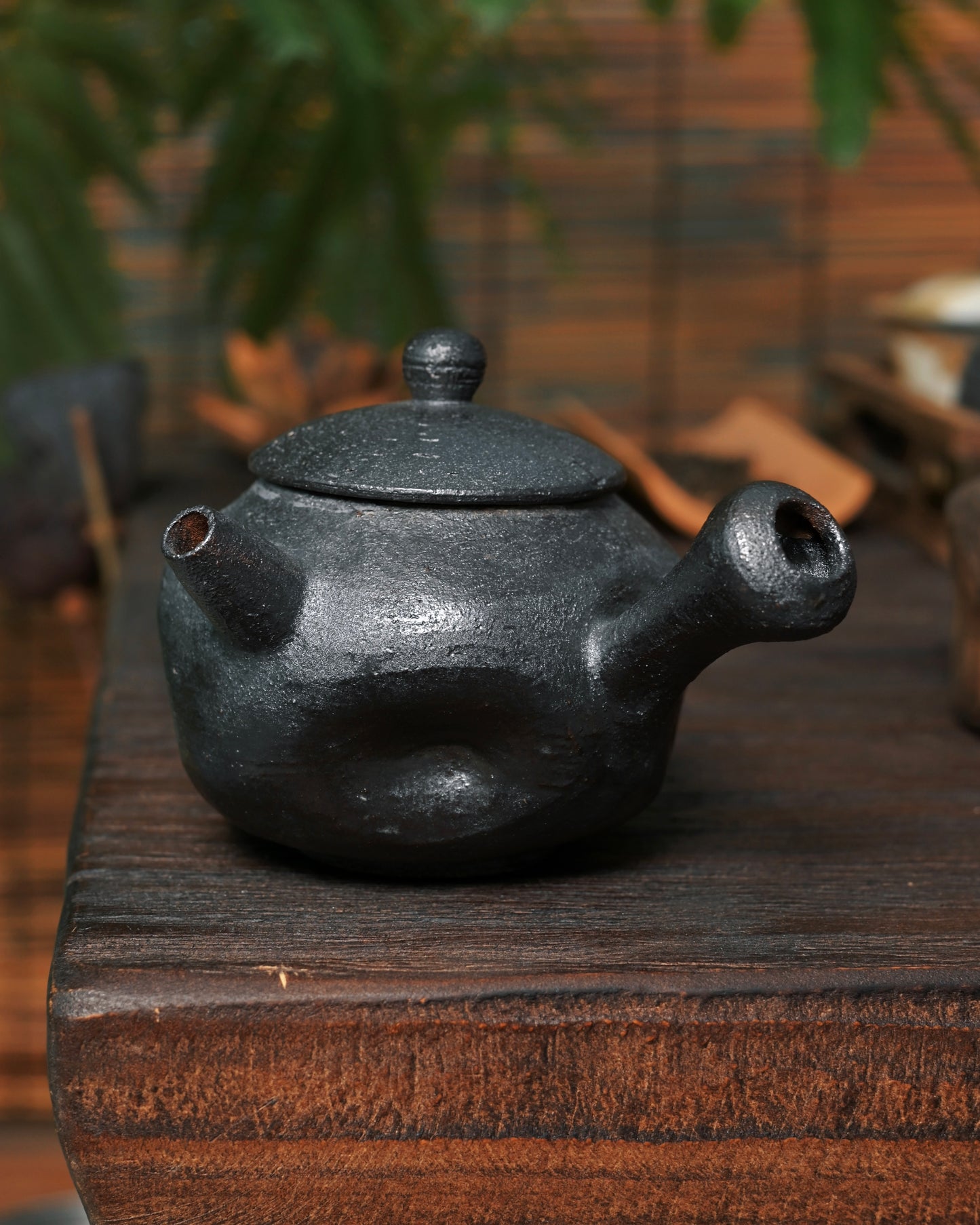 Slow ceramic making process involving hand-forming and extended wood firing cycles