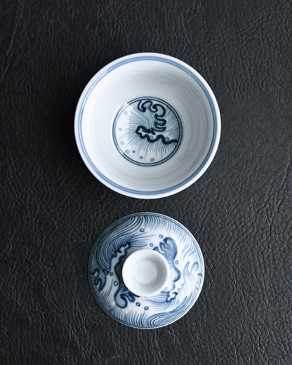 Small lidded tea bowl balancing functional design with historical artistic expression