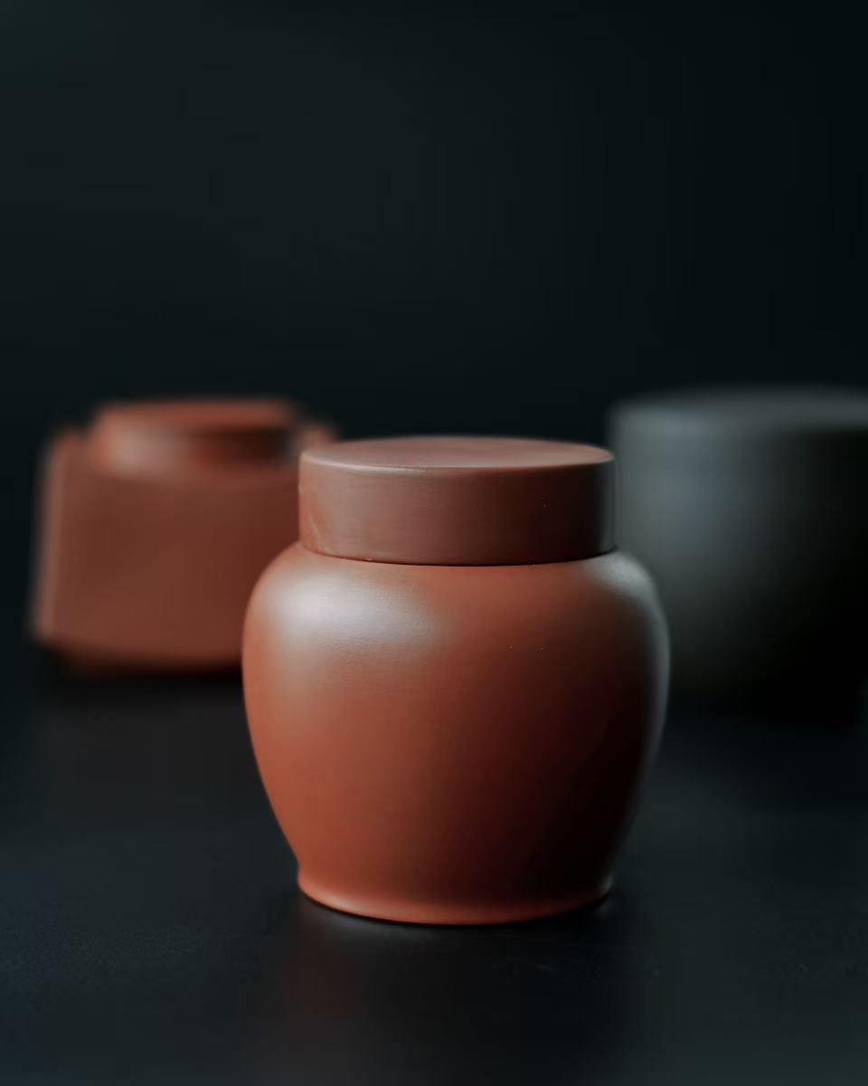 Minimalist Yixing clay tea caddy featuring classic design and practical size for on-the-go tea drinking