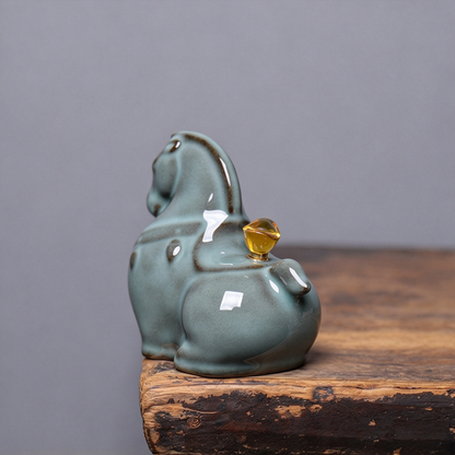 Side profile of Longquan Celadon horse statuette with smooth crackle glaze finish