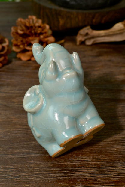Top-down view of Ru kiln sky-blue elephant tea pet showing smooth ears and glaze highlights