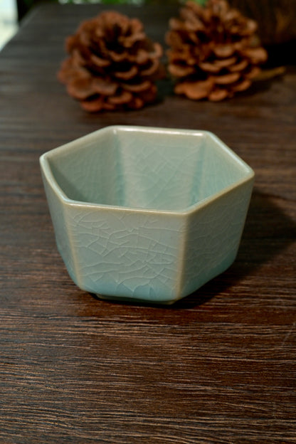 Handmade Ru Ware hexagonal teacup displaying jade-like matte glaze texture and crackle lines