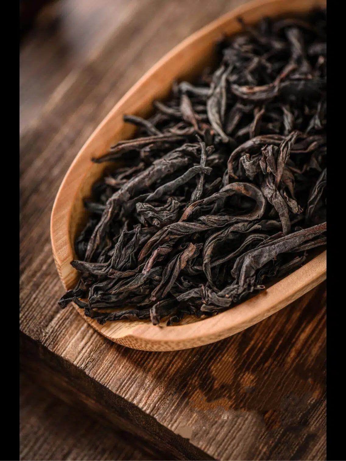 Traditional charcoal-roasted Da Hong Pao Oolong Tea leaves with elegant floral and mineral character.