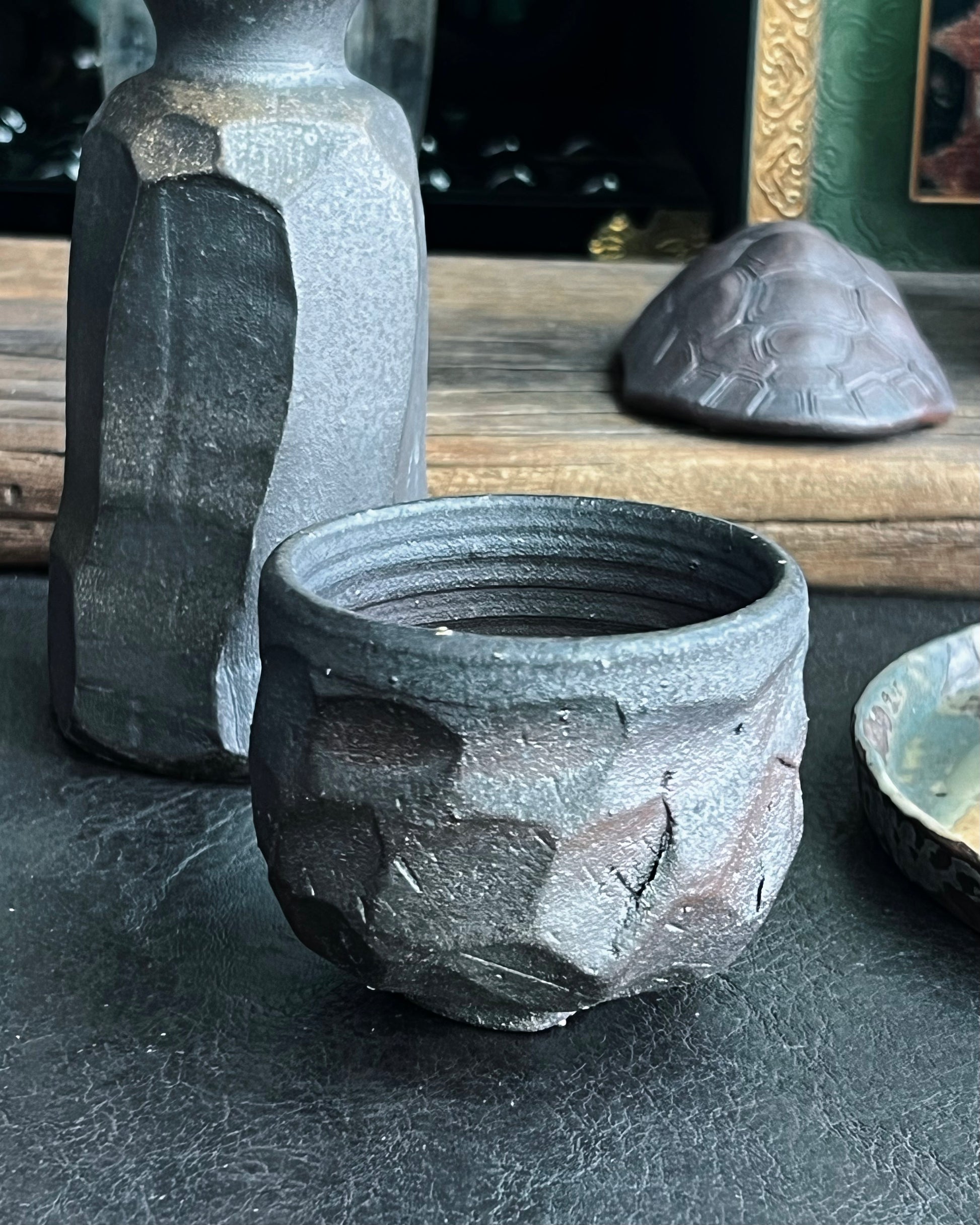 Naturally developed patina on cup surface from repeated tea absorption and use