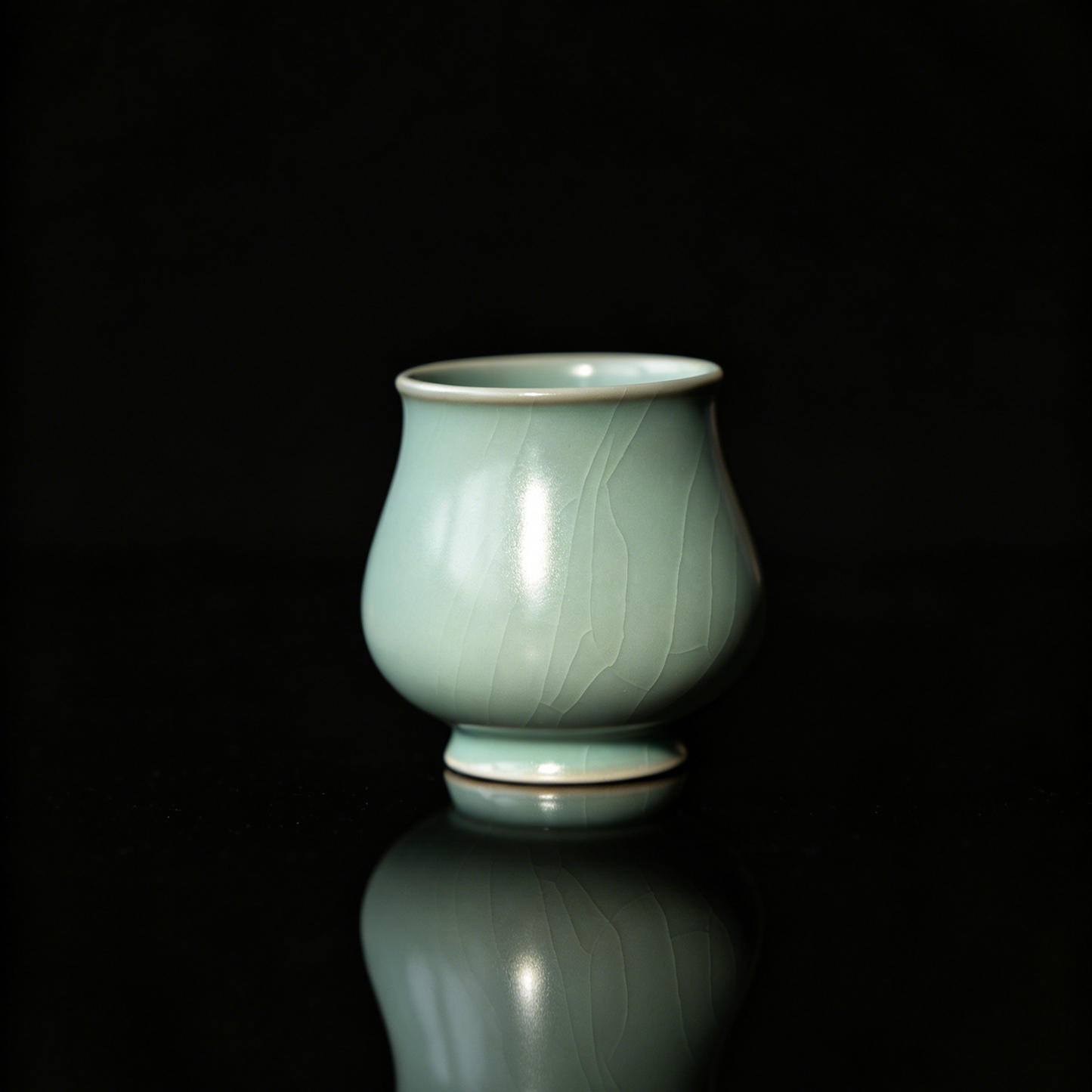 Artisan Ru Ware sky-blue teacup in an elegant magnolia flower bud shape.