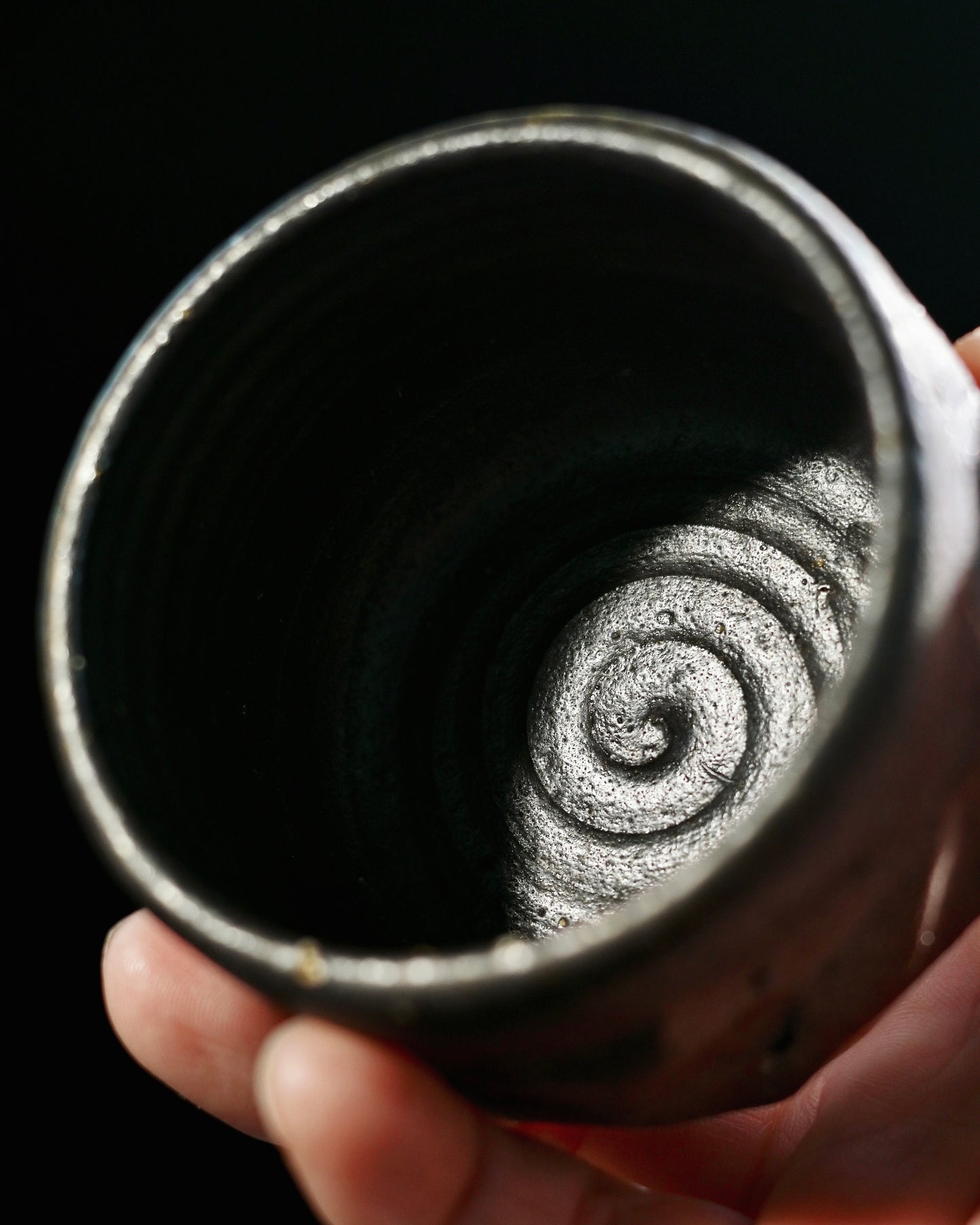 Textured porous clay structure that breathes with tea during brewing and drinking