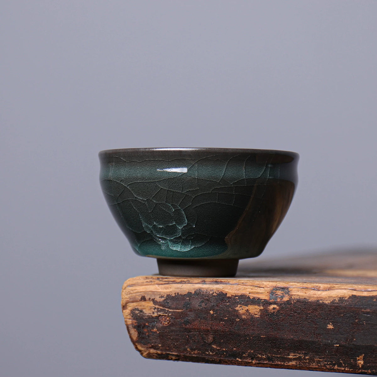 Handmade Longquan Celadon 135ml master tasting cup displaying glossy jade glaze and crackle lines