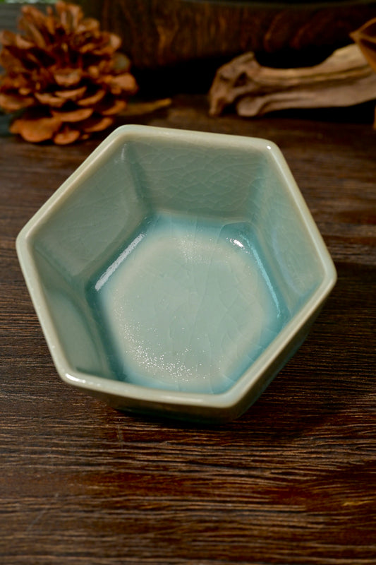 Top-down view of hexagonal Ru kiln sky-blue teacup showing six-sided rim and smooth interior