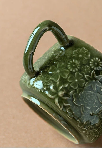 Detailed relief-carving on handmade celadon teapot