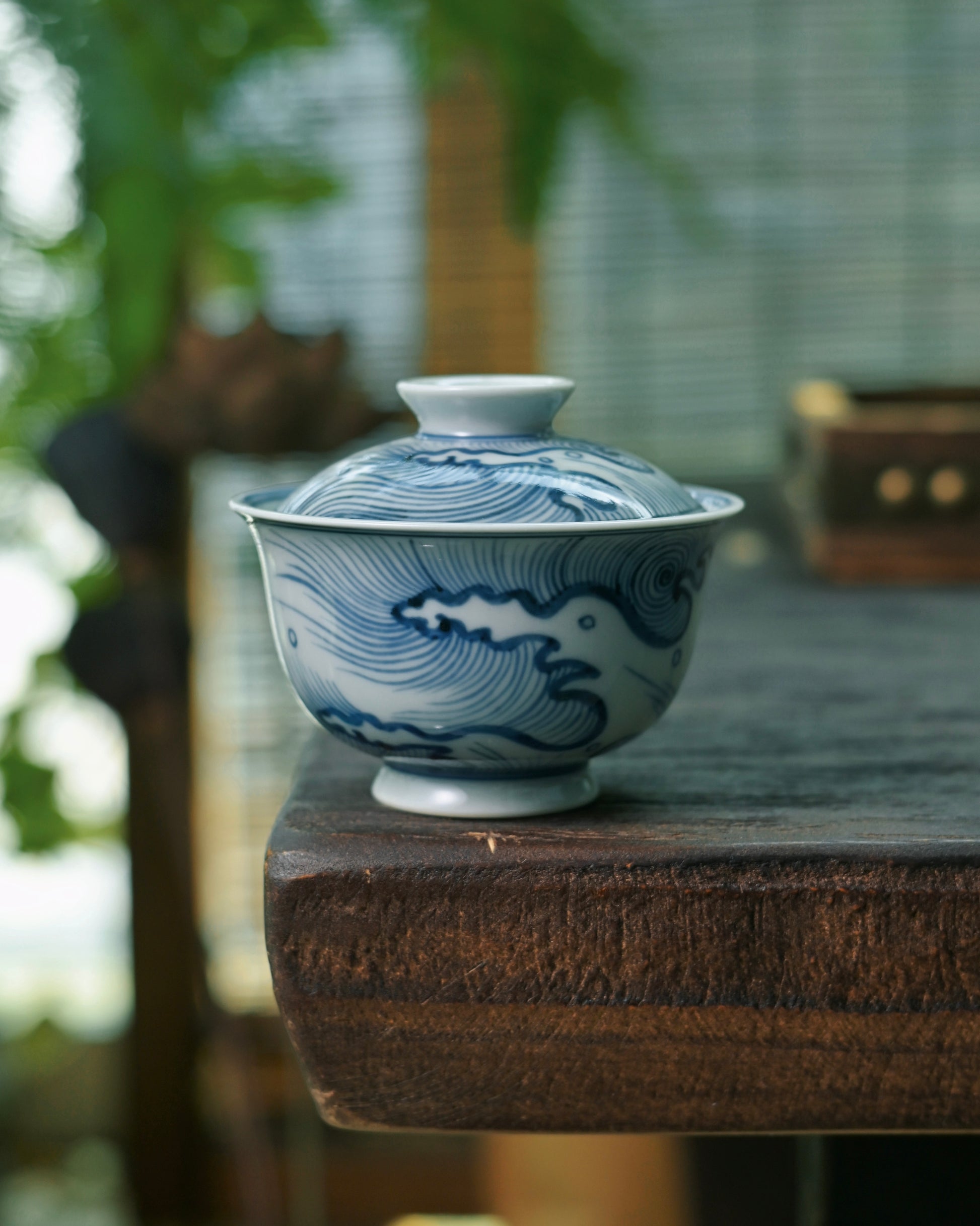 Traditional Chinese brushwork technique applied directly on porcelain before glazing