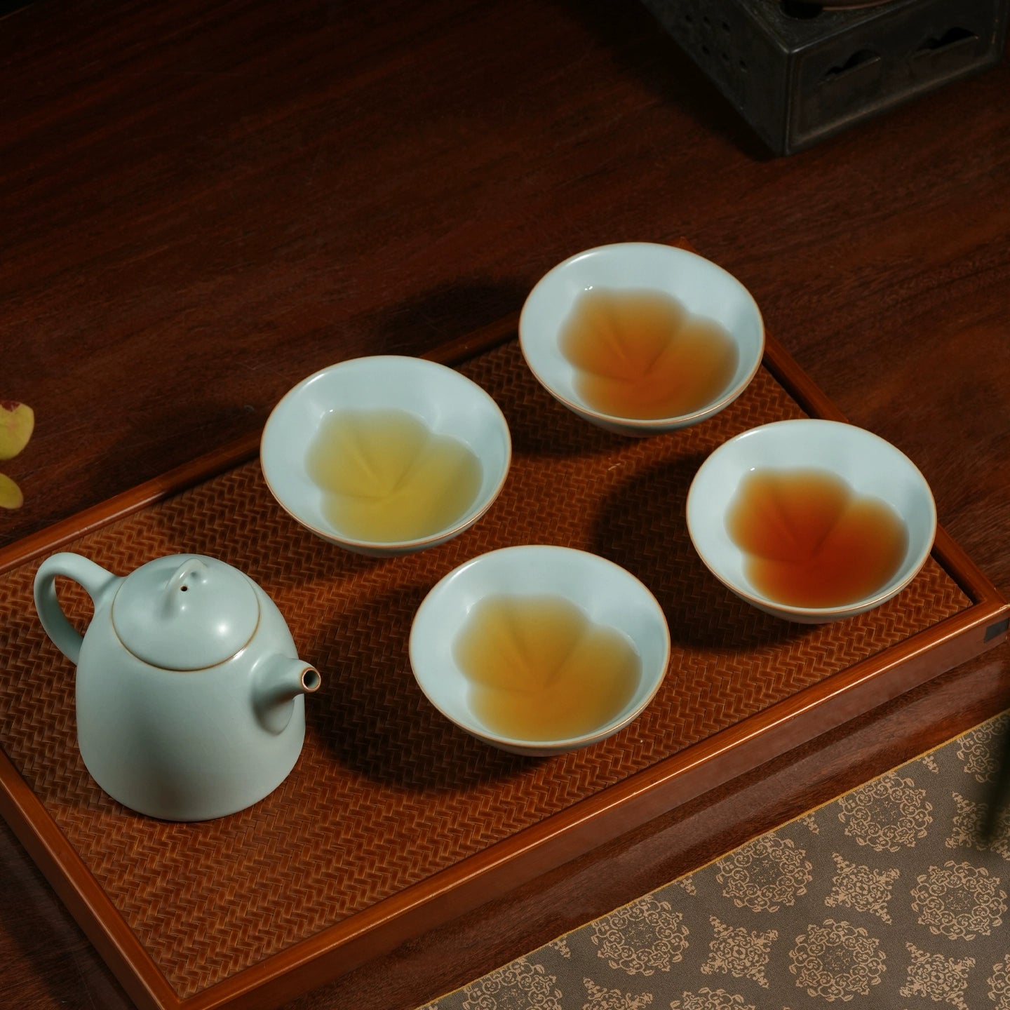 Fine artisan Ru ware teacup showcasing ice-crack textures and a discreet gourd profile, perfect for daily tea practice.