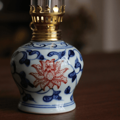 Traditional porcelain butter lamp with blue and white and underglaze red design, tea art display piece